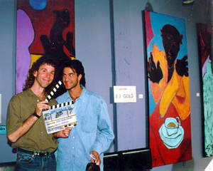 Color photo of E.J. Gold paintings being used on set in movie