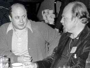 Black and white photo sitting at a table in a restaurant