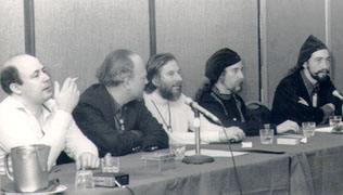 Black and white photo showing the panel sitting on one side of a table
