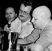 Black and White photo fo Ben Bova, Jerry Pournelle and E.J. Gold on panel discussion